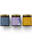 Coffret cadeau bougies Chaleur d’automne en bocaux verre ambre et couvercles dorés avec étiquettes pastel botaniques