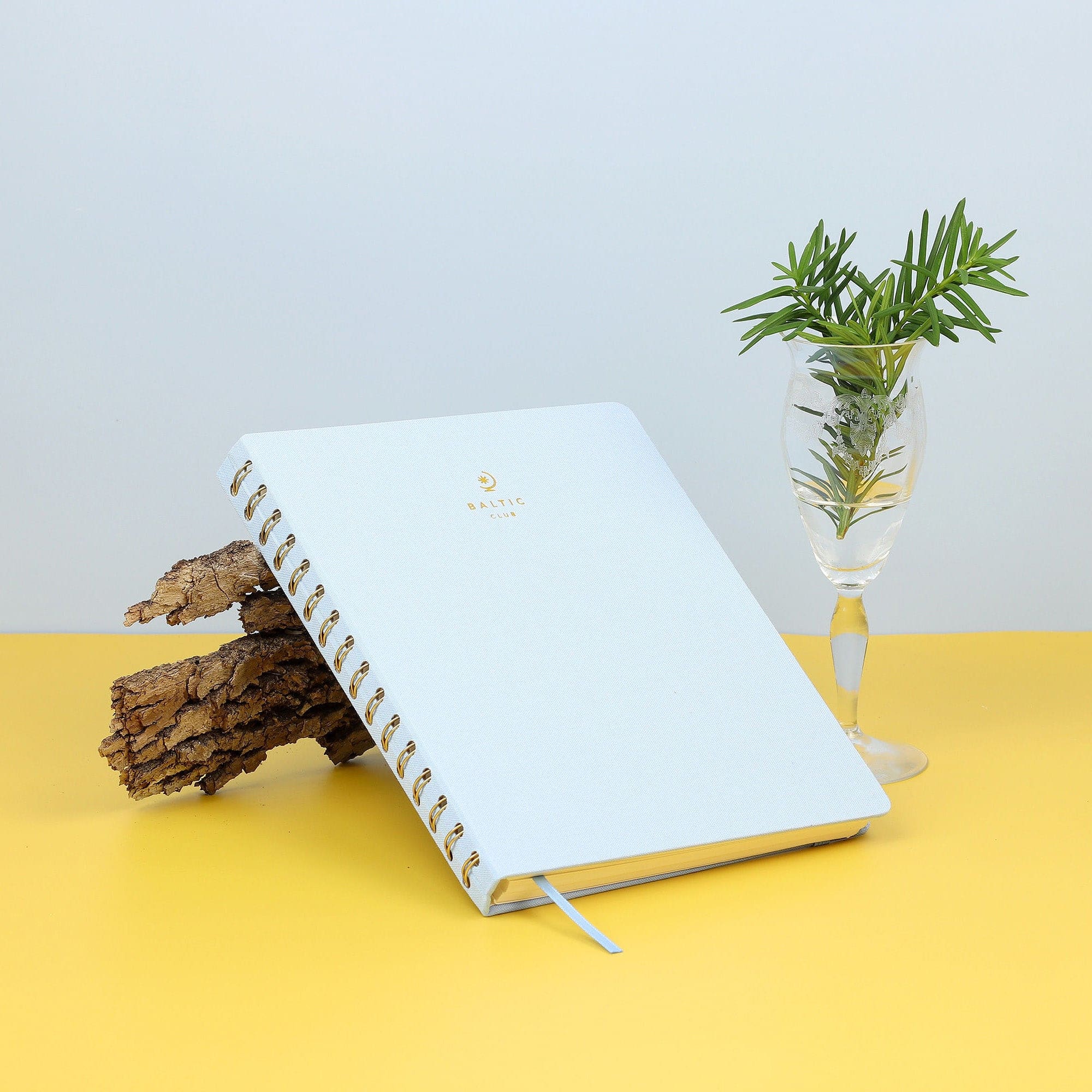 The Blue Ash Cloth-covered Undated Planner on a table