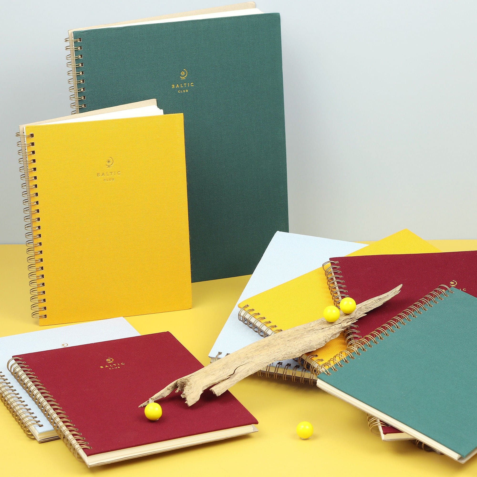 The large burgundy cloth-covered spiral notebook by the Baltic Club with the other available colours