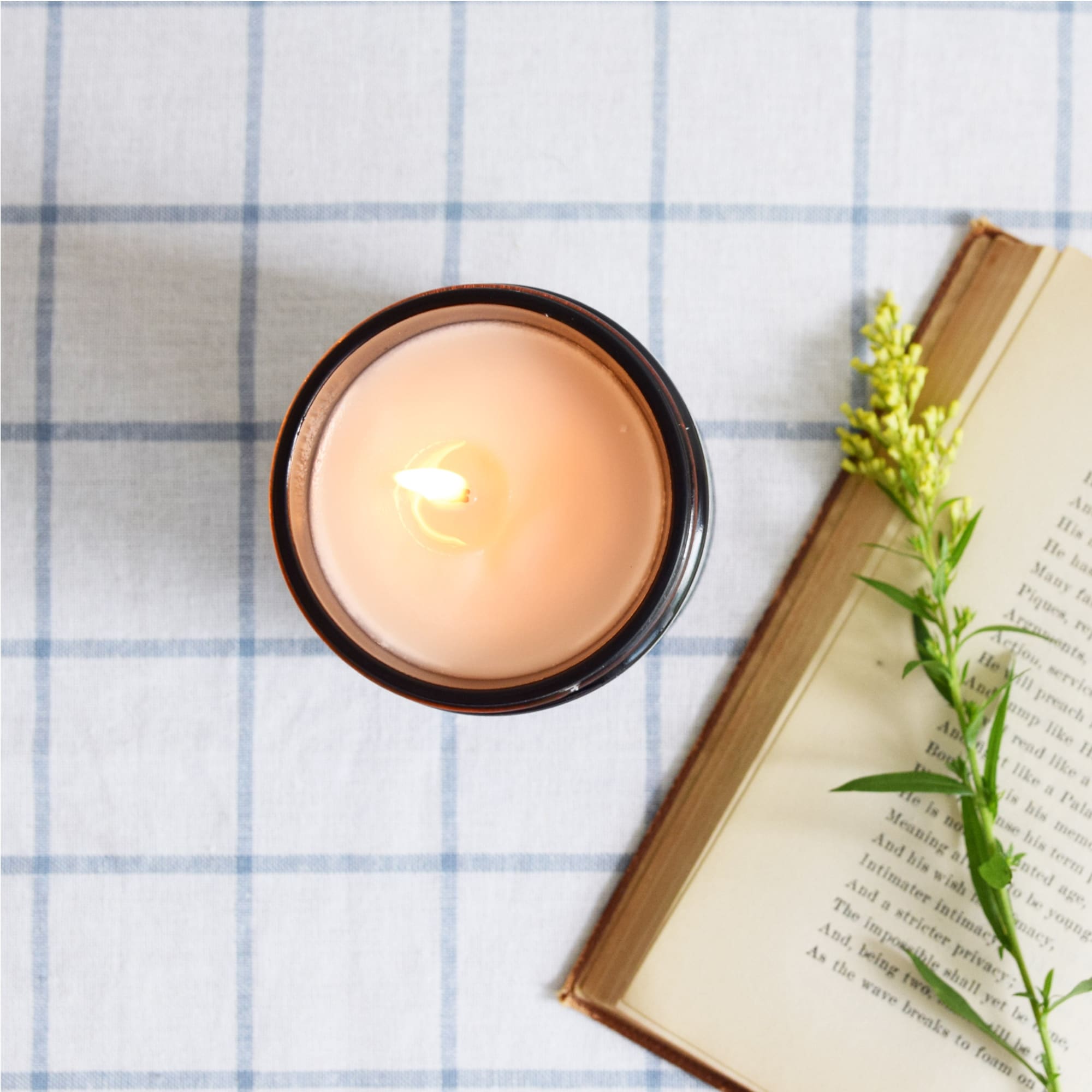 The Baltic Club&#39;s Lavender &amp; Sage Soy Candle lit and seen from above