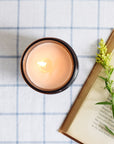 The Baltic Club's Lavender & Sage Soy Candle lit and seen from above