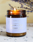 The Baltic Club's Lavender & Sage Soy Candle lit and seen from the front
