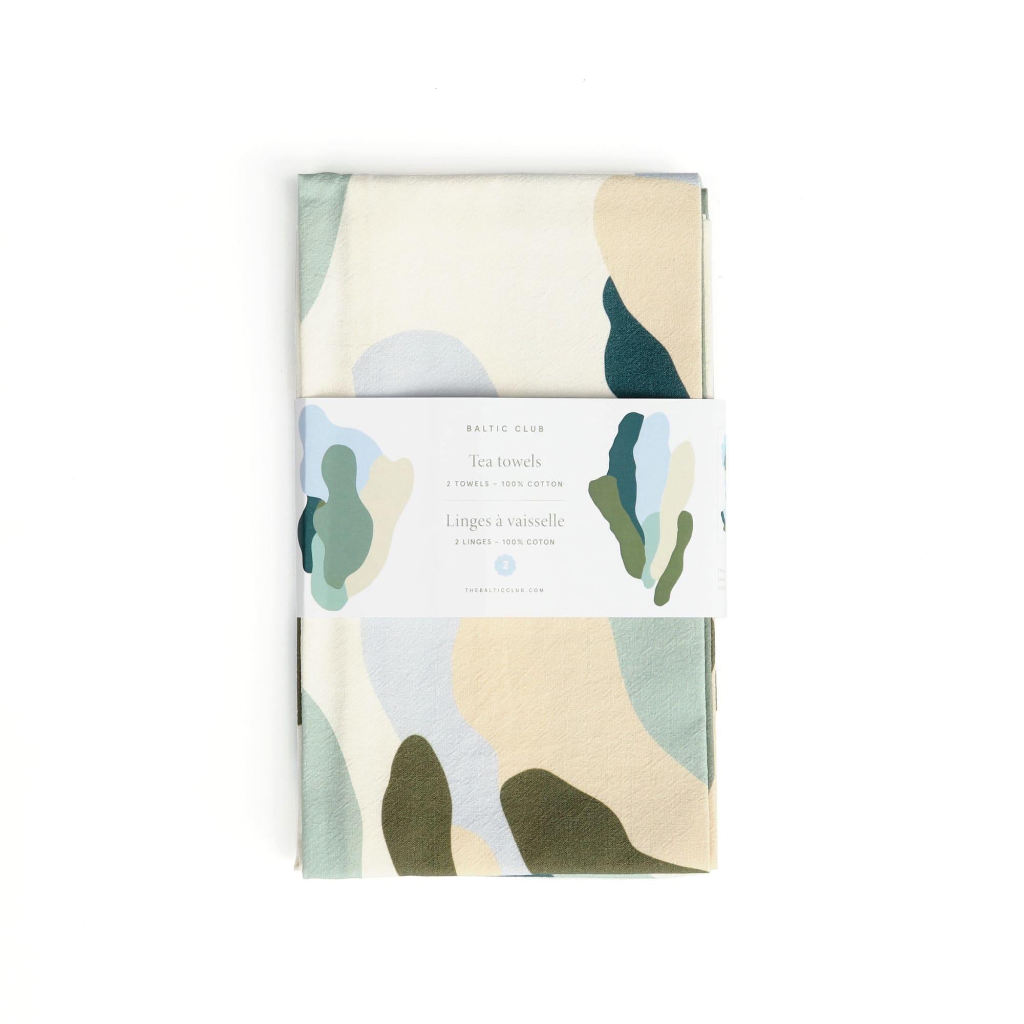 The set of two tea towels featuring the Moss illustrations with its packaging.