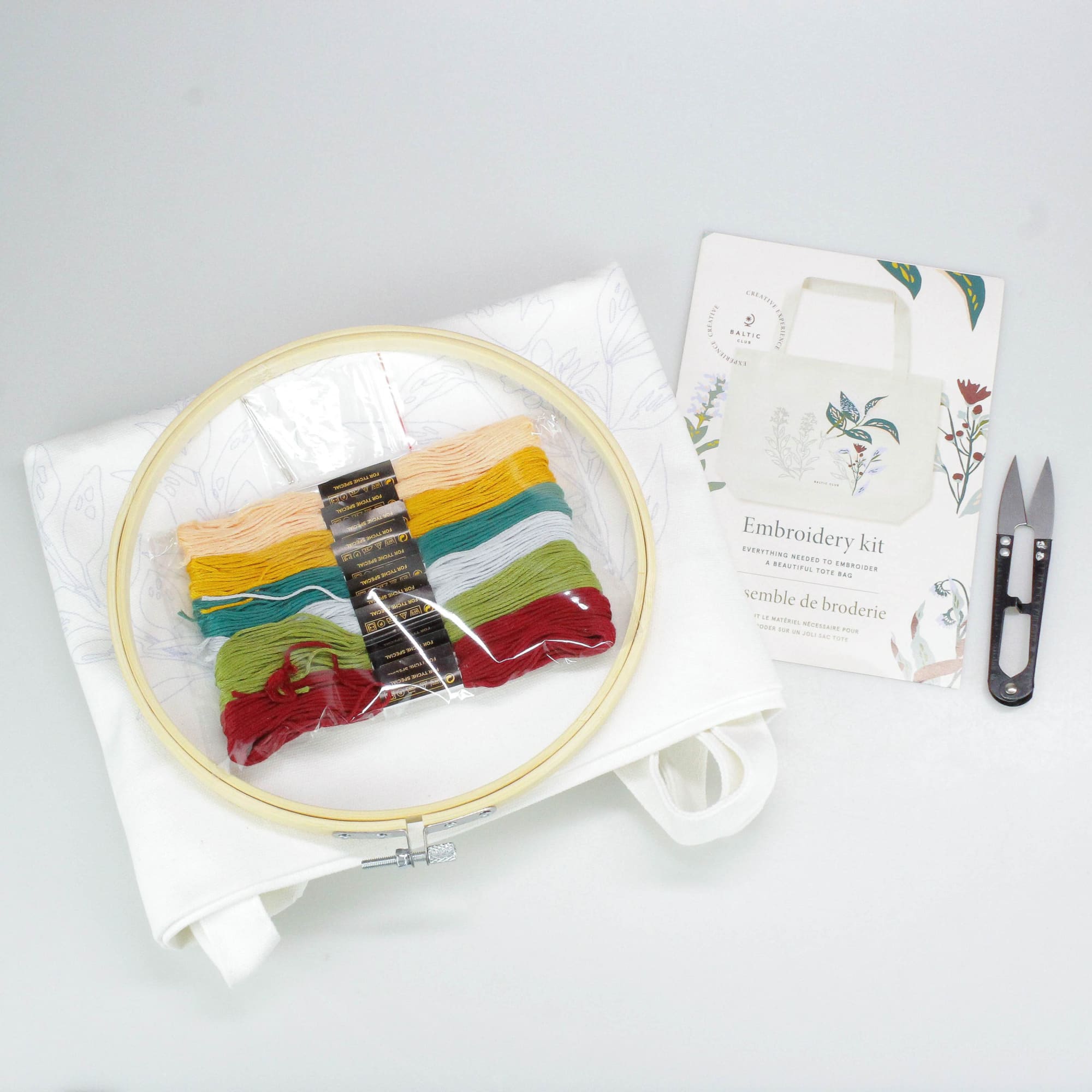 Embroidery kits for adults by the Baltic Club, displayed on a table with all the elements included