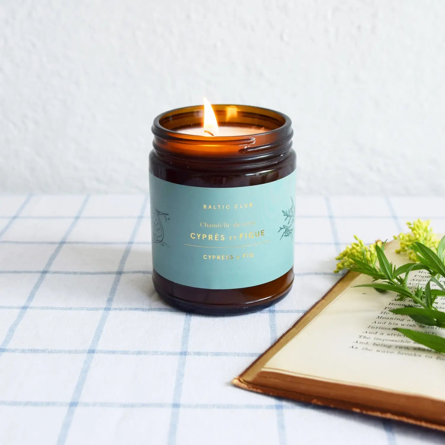 Cypress and Fig soy wax Candle by Baltic Club on a table in a clean kitchen
