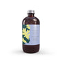 Oak & Sage reed diffuser refill in a glossy amber glass bottle with silver ribbed cap and lavender-blue label