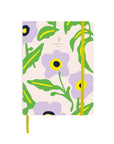 Agenda Serenade fermé avec motif floral lilas et élastique jaune sur fond blanc