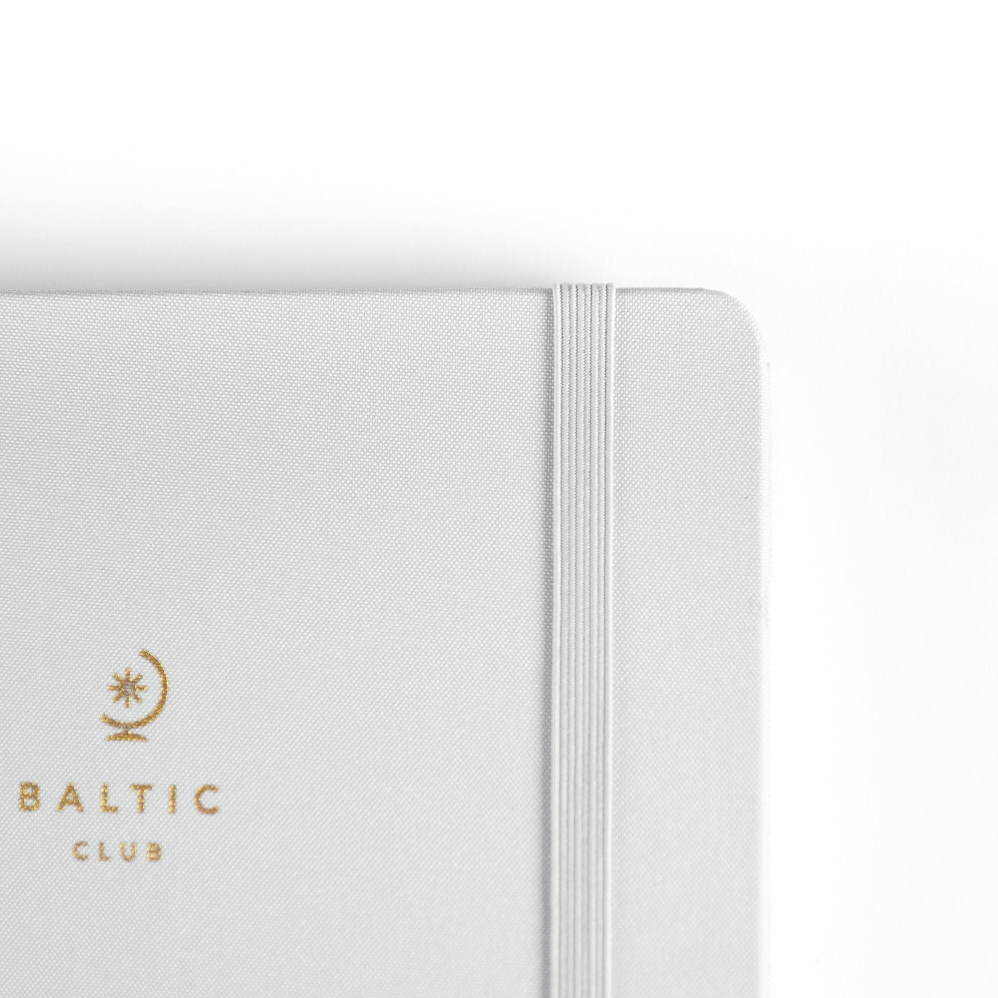 The elastic band on the front cover of the Grey Cloth-covered Undated Planner from The Baltic Club